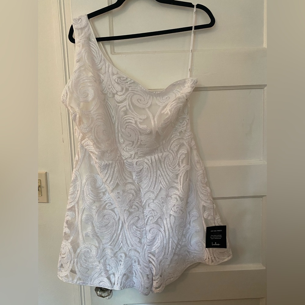 White sequin shorts romper dress from Lulu’s. Great material.